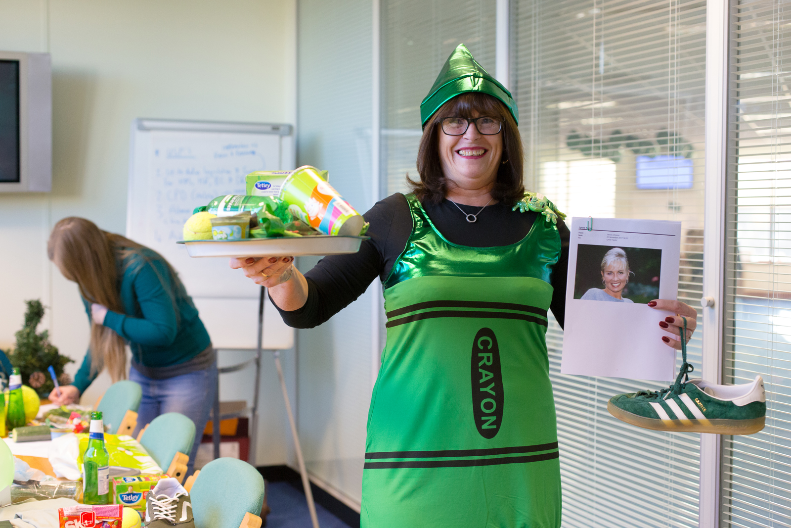 Towergate Colleague dressed up as a green crayon for Go Green Day
