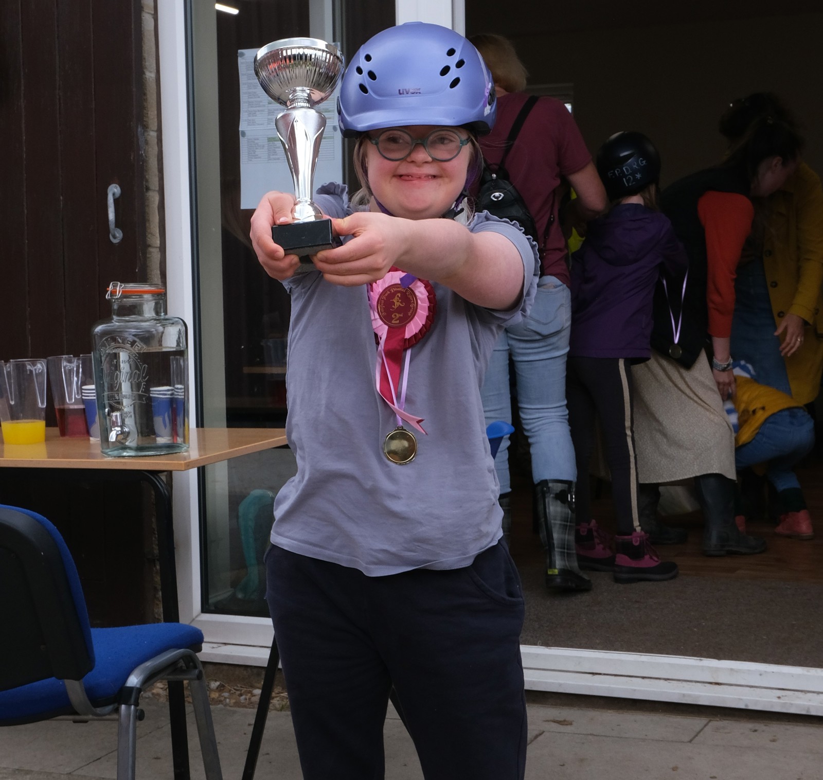 A girl who rides at Follifoot holding a trophy