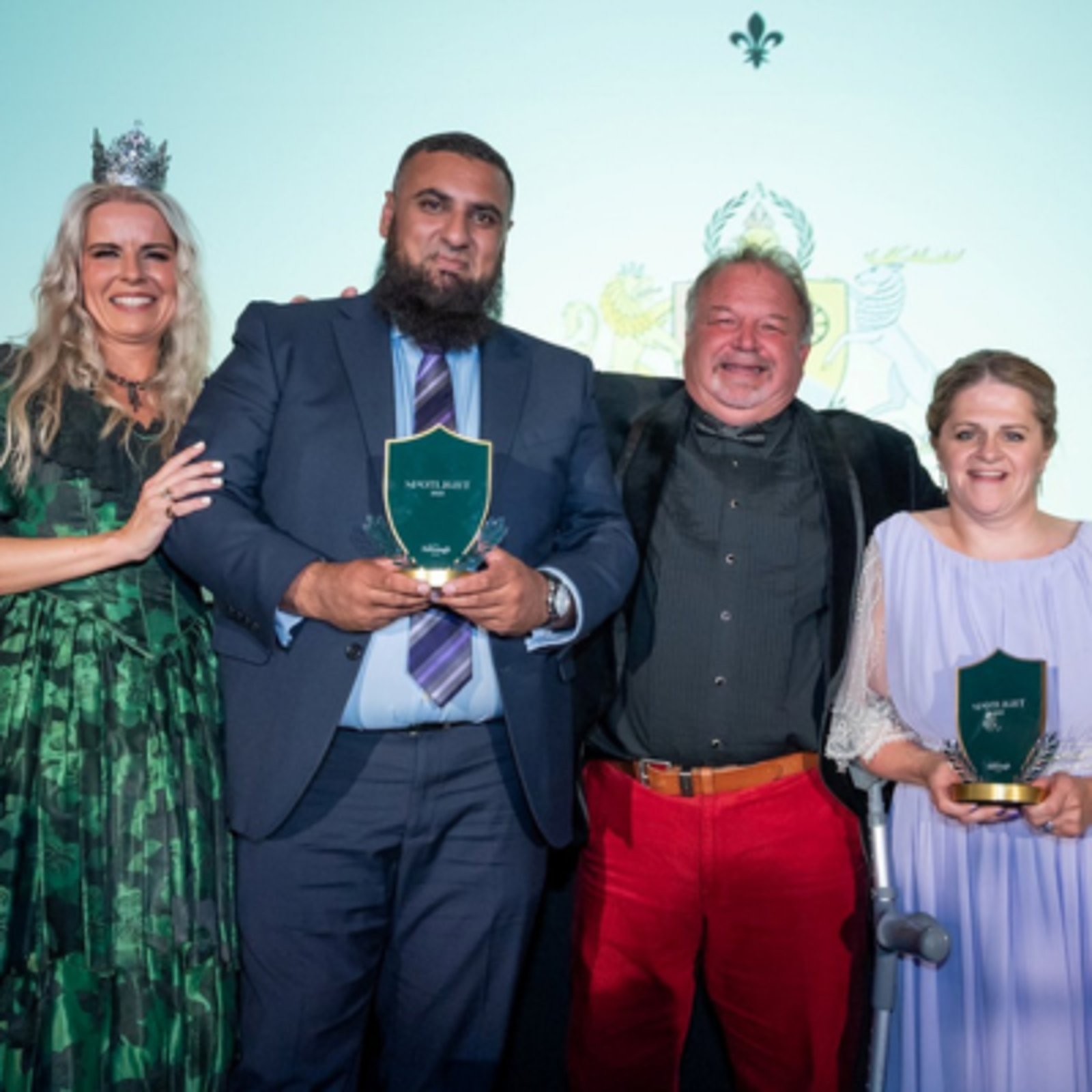 Kelly Ann Knight and Derek Coles stood with ACT Spotlight Awards winners, Kam and Helen