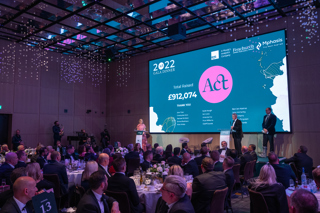 Grand total raised displayed on stage in front of the audience at the 2022 ACT Gala Dinner