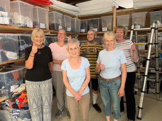 Volunteers at Leeds Baby Bank pose with their donations