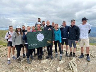 Ardonagh Specialty team standing together on top of the mountain