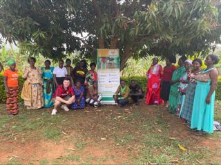 Women from a rural village in Africa who took part in the pilot project and Rural Inclusion founder, Jack Farren