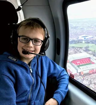 Freddie Williams (in who's memory the Bright future prize was set up for) in a helicopter flying over Anfield, in Liverpool