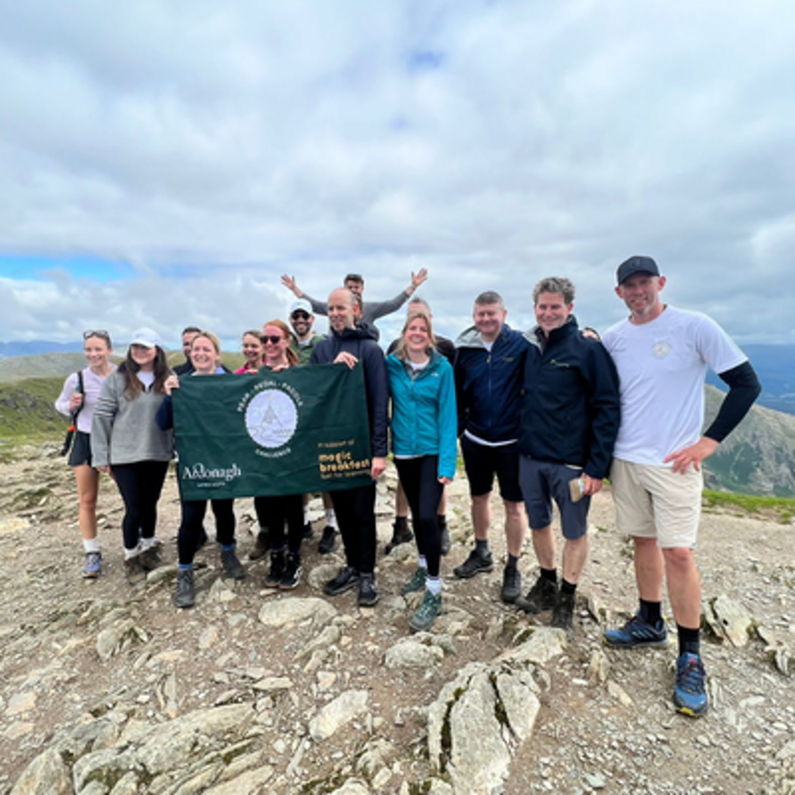 Ardonagh Specialty team standing together on top of the mountain